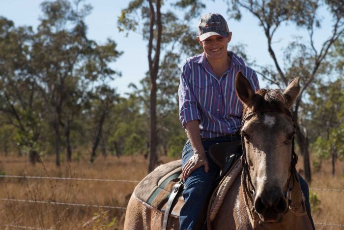 PHOTO: Jodie Ward on horseback while training for the 2017 Mongol Derby in Darwin. (ABC News: Kristy O'Brien)
