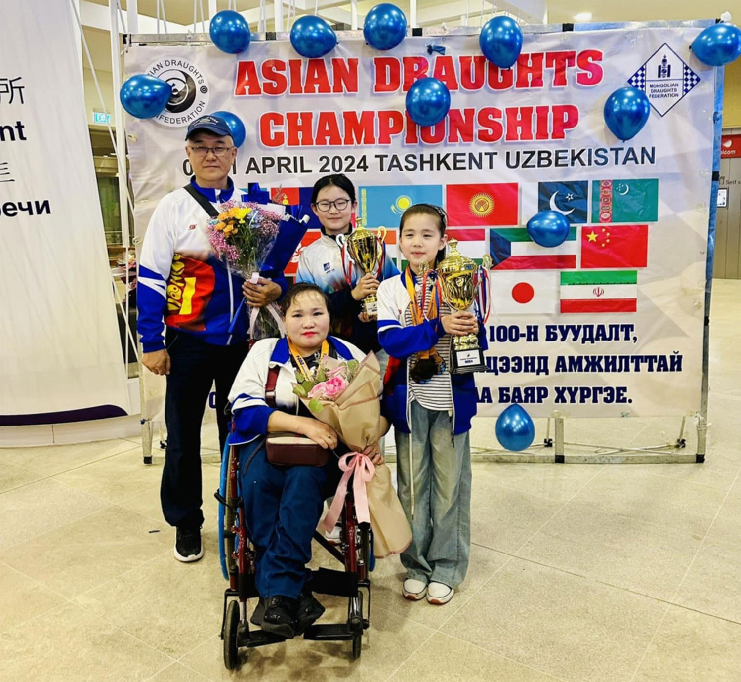 She is with her sister G.Gerelmaa and two coaches, P.Enkhsaarul and Z.Ganbaatar,